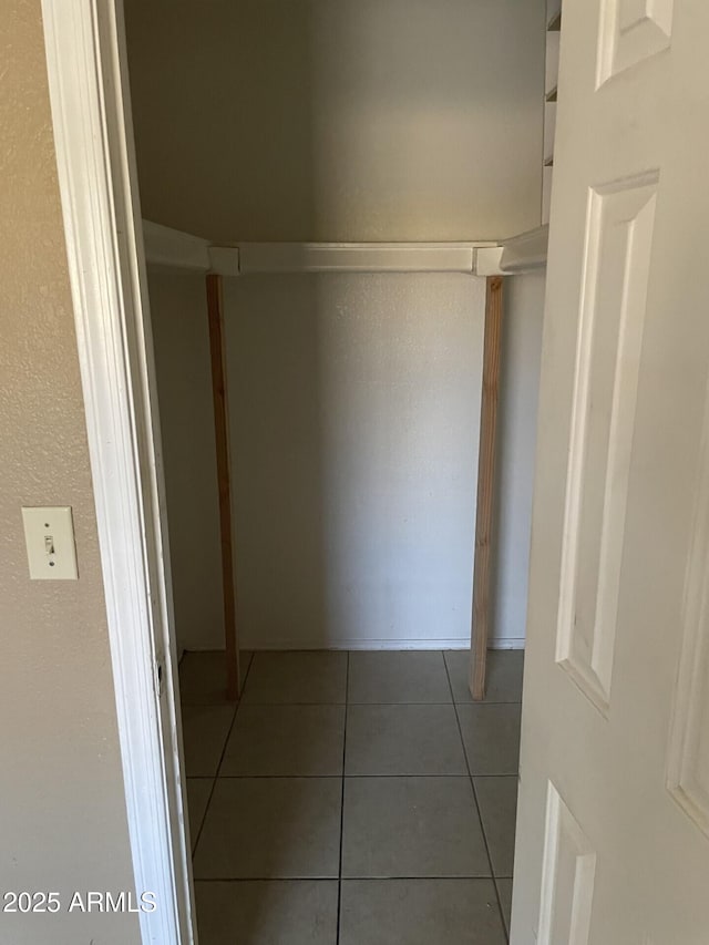 hallway featuring tile patterned flooring