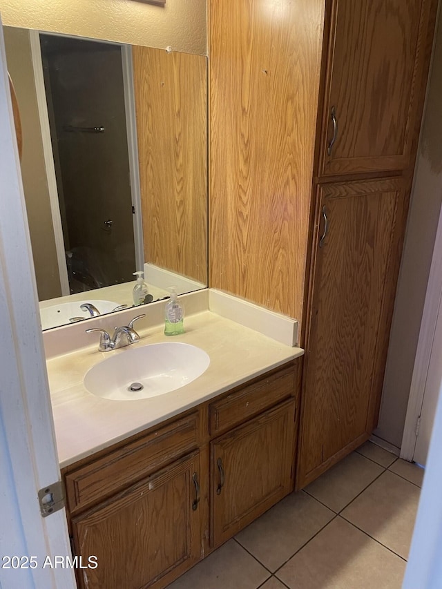 bathroom with tile patterned flooring and vanity