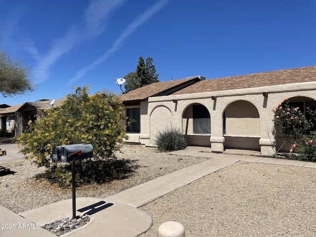 view of front of property featuring stucco siding