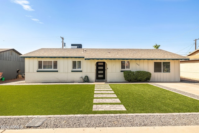 ranch-style home with a front lawn