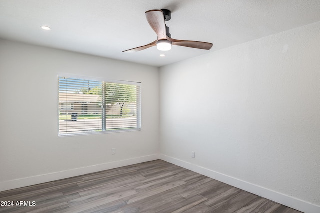 unfurnished living room with light wood-type flooring, a textured ceiling, and a fireplace