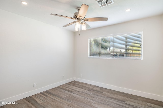 unfurnished bedroom featuring ceiling fan, a closet, and dark hardwood / wood-style flooring