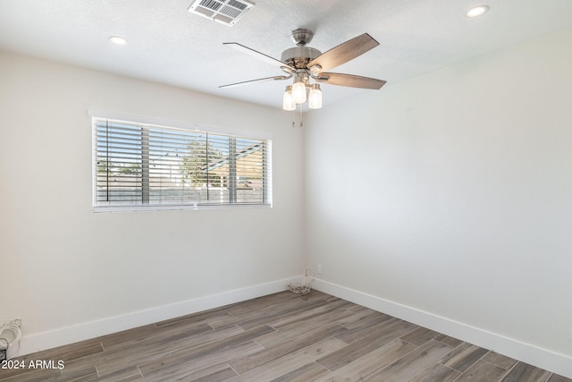 unfurnished bedroom featuring hardwood / wood-style flooring, a closet, and ceiling fan