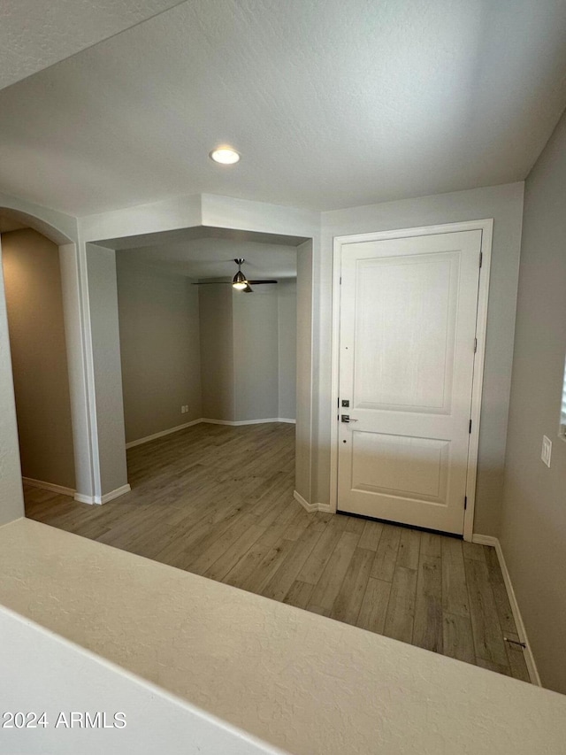 entryway featuring ceiling fan and wood-type flooring