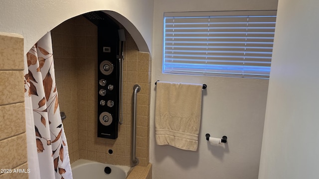 bathroom featuring shower / bath combo with shower curtain