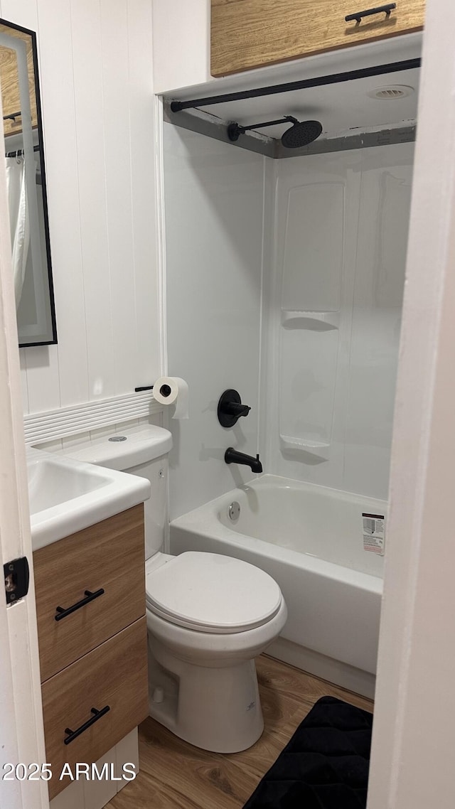 full bathroom featuring vanity, shower / bathtub combination, toilet, and wood-type flooring