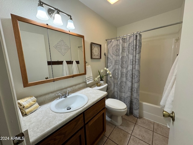 full bathroom with tile patterned flooring, vanity, toilet, and shower / bath combo with shower curtain