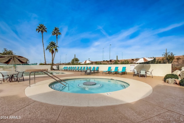 view of swimming pool with a patio area