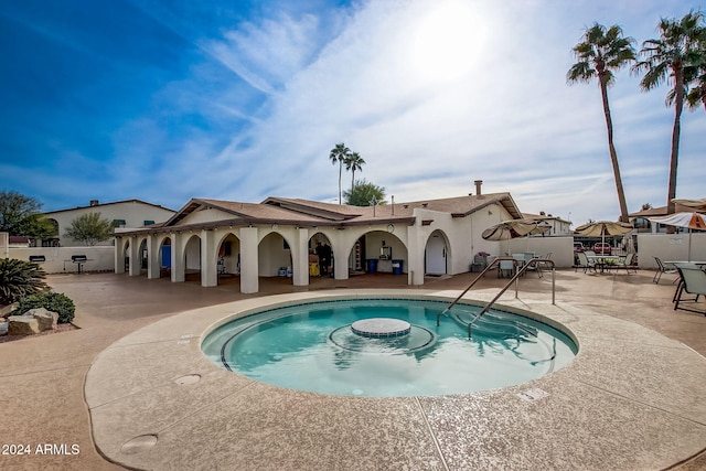 view of swimming pool with a patio area