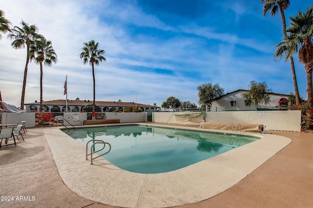 view of swimming pool featuring a patio area