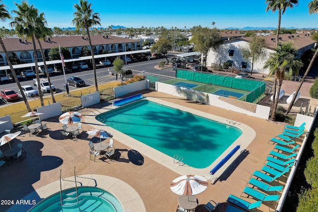 view of swimming pool with a patio