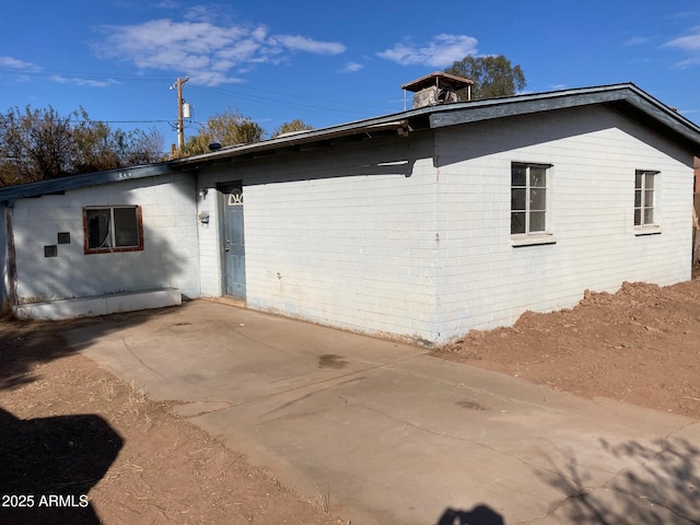 view of home's exterior with a patio area