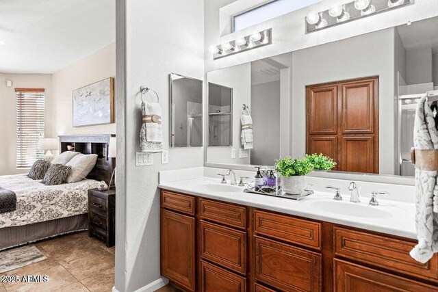 bathroom featuring tile patterned floors, vanity, and a wealth of natural light