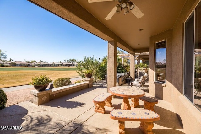 view of patio / terrace featuring ceiling fan