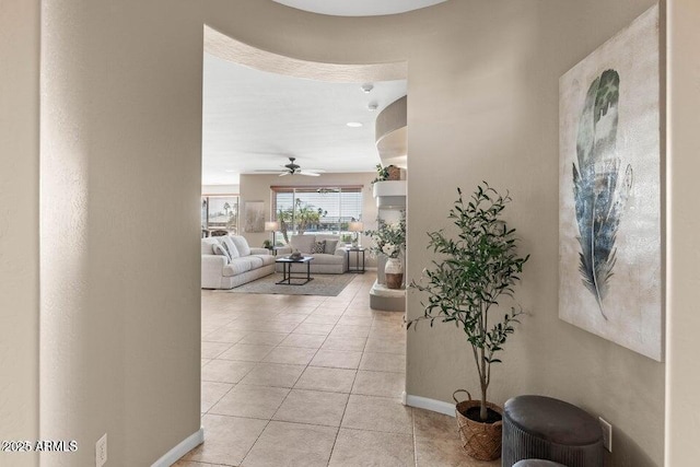 hall featuring light tile patterned floors