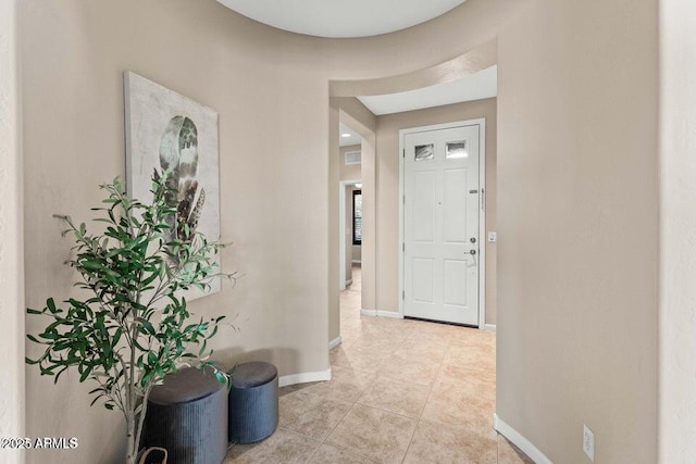 corridor with light tile patterned floors