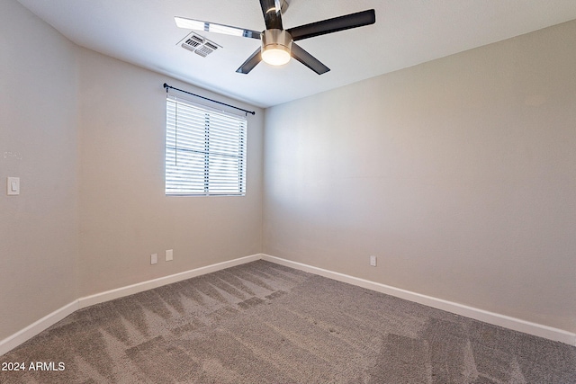 carpeted empty room with ceiling fan