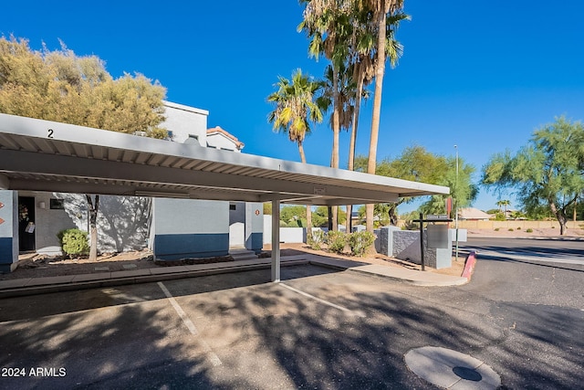 view of vehicle parking featuring a carport