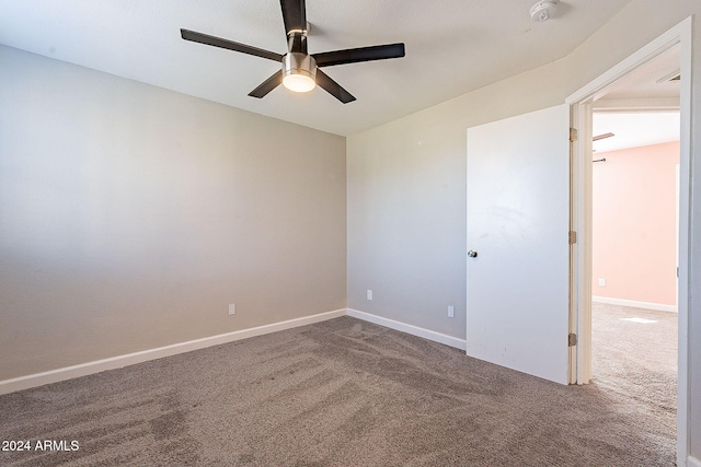 empty room with carpet flooring and ceiling fan