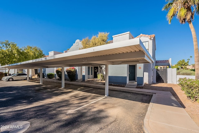 view of parking / parking lot with a carport