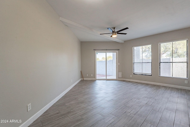 unfurnished room featuring light hardwood / wood-style flooring, lofted ceiling, and ceiling fan