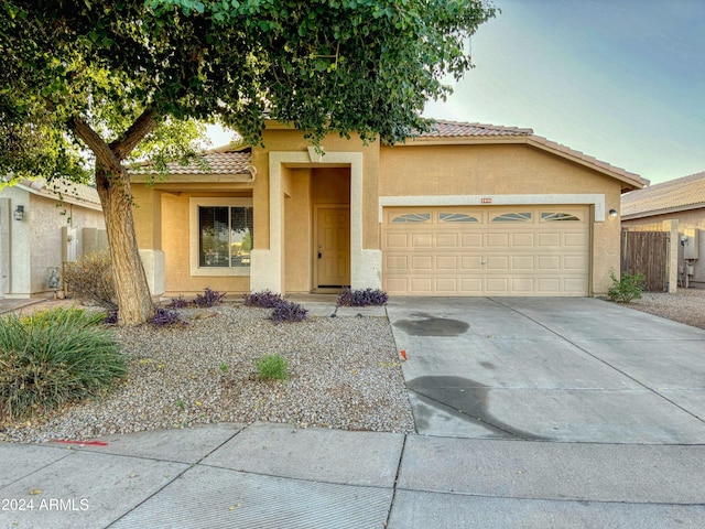 view of front of property with a garage