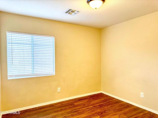 unfurnished room featuring hardwood / wood-style floors