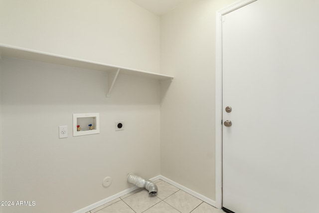 laundry area featuring light tile patterned floors, hookup for a gas dryer, hookup for a washing machine, and electric dryer hookup