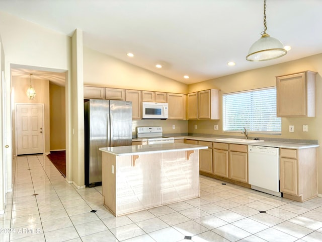 kitchen featuring sink, vaulted ceiling, light brown cabinetry, white appliances, and a center island