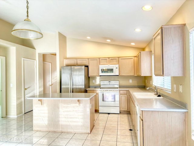 kitchen featuring light brown cabinets, sink, vaulted ceiling, decorative light fixtures, and white appliances