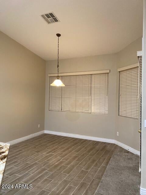 empty room featuring dark hardwood / wood-style flooring