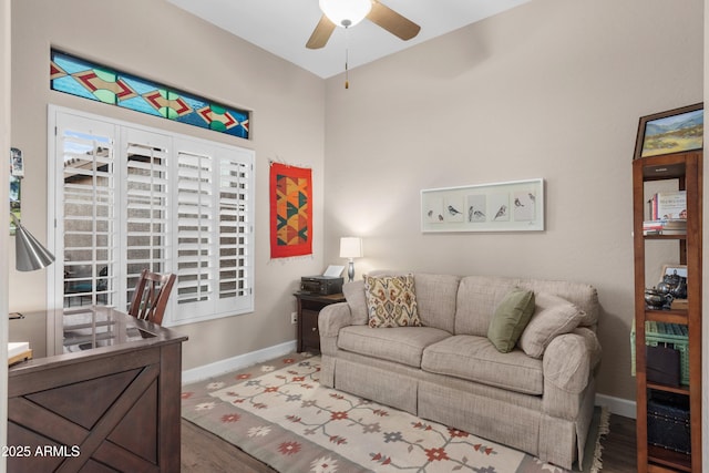 living room featuring ceiling fan and hardwood / wood-style floors