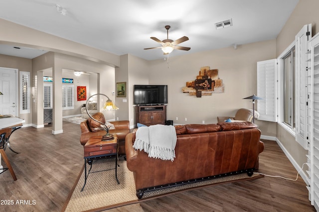 living room with hardwood / wood-style flooring and ceiling fan