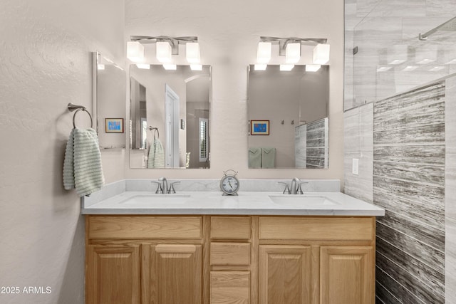 bathroom with a shower and vanity