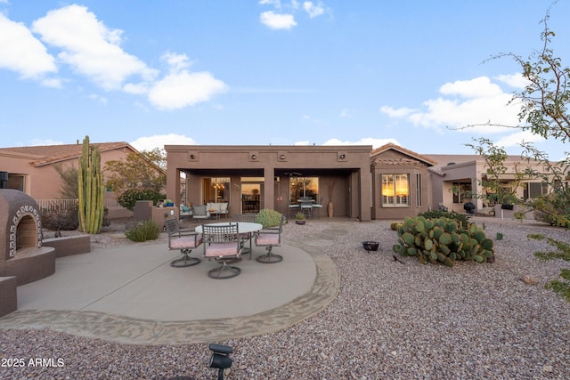 rear view of house featuring a patio