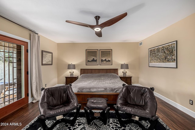 bedroom with ceiling fan and dark hardwood / wood-style flooring