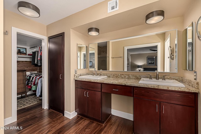 bathroom featuring vanity and hardwood / wood-style flooring