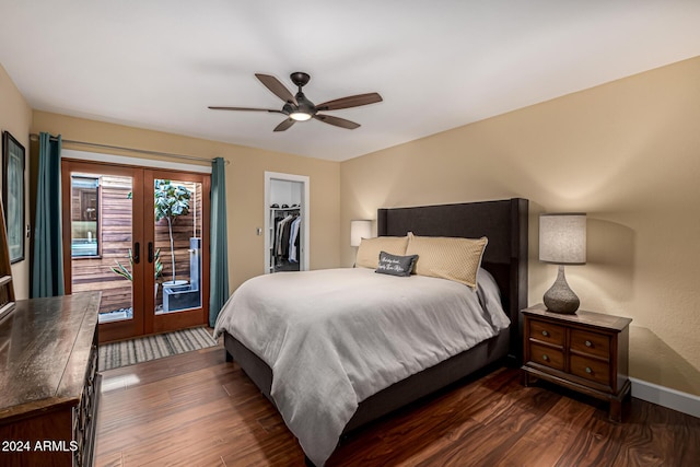 bedroom with french doors, ceiling fan, a spacious closet, dark hardwood / wood-style floors, and a closet