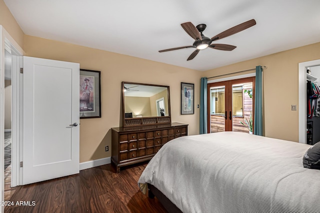 bedroom featuring dark wood-type flooring, french doors, a walk in closet, ceiling fan, and a closet