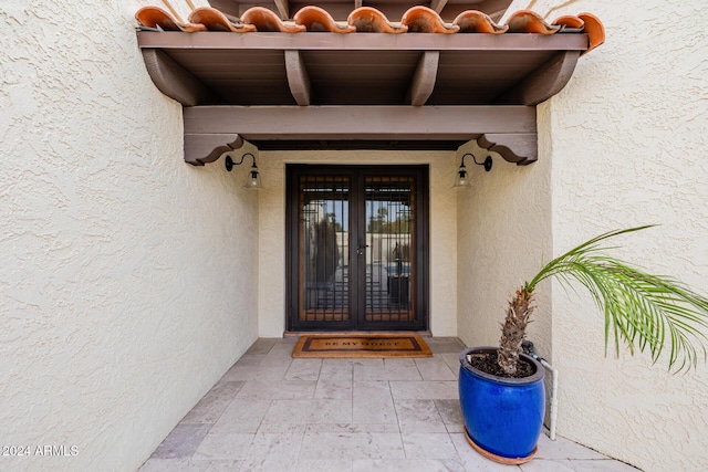 doorway to property with french doors