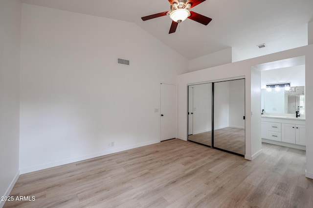 unfurnished bedroom with light wood-type flooring, visible vents, and baseboards