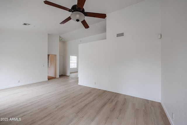 spare room with light wood-type flooring, baseboards, visible vents, and a ceiling fan