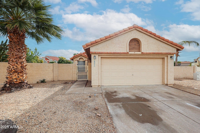 exterior space featuring a garage, concrete driveway, a gate, fence, and stucco siding