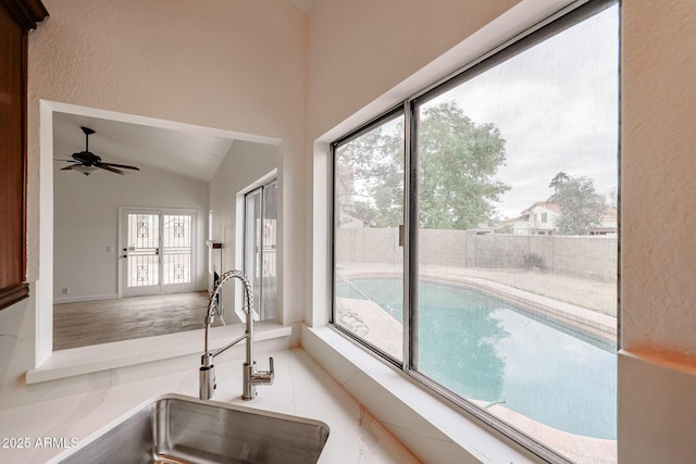 view of swimming pool featuring a sink