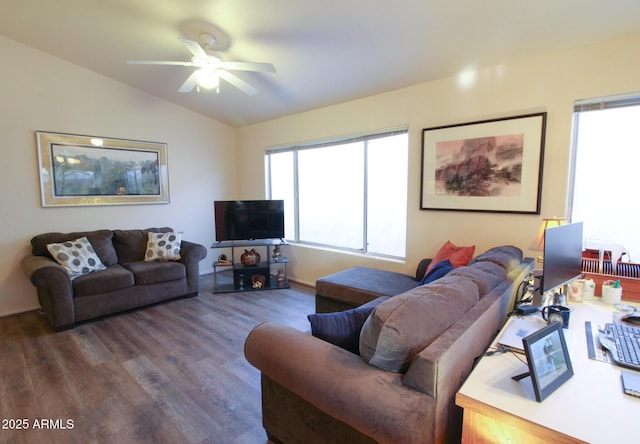 living room featuring ceiling fan, dark hardwood / wood-style flooring, vaulted ceiling, and a wealth of natural light