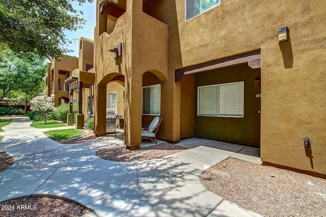 property entrance with a patio area