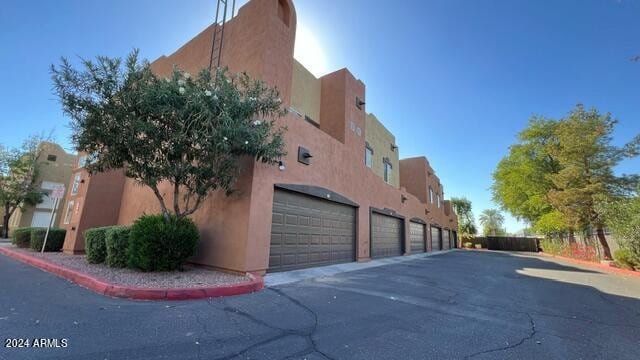 view of building exterior featuring a garage