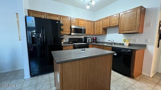 kitchen with sink, light tile patterned floors, black appliances, and a center island