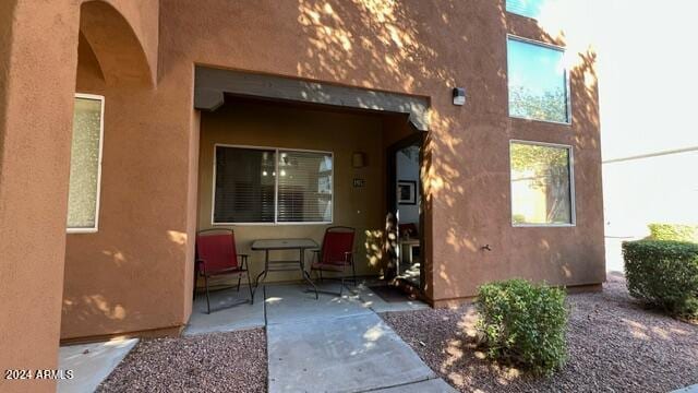 property entrance featuring a patio area