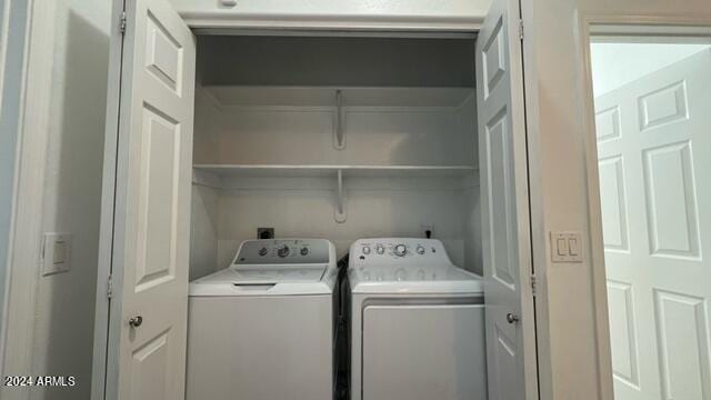 laundry room with separate washer and dryer